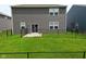 Fenced backyard with lawn and patio provides privacy at 10319 Pronghorn Ln, Indianapolis, IN 46239