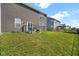 A spacious backyard with a well-maintained lawn and black chain link fence around the perimeter at 10319 Pronghorn Ln, Indianapolis, IN 46239
