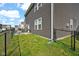 This backyard features a chainlink fence and a small lawn at 10319 Pronghorn Ln, Indianapolis, IN 46239