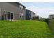 Backyard features a lush lawn and black chain-link fence at 10319 Pronghorn Ln, Indianapolis, IN 46239