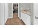 This bathroom has double sinks, a walk-in shower, and a view of the closet at 10319 Pronghorn Ln, Indianapolis, IN 46239
