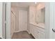 Bright bathroom features a double sink vanity, large mirror, and glass-enclosed shower at 10319 Pronghorn Ln, Indianapolis, IN 46239