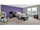 This bedroom features carpet, a window with blinds, and purple accent wall at 10319 Pronghorn Ln, Indianapolis, IN 46239