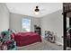 This bedroom has carpet and a window with blinds at 10319 Pronghorn Ln, Indianapolis, IN 46239