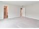 Large bedroom with walk-in closet, neutral paint, and plush carpeting, offering ample living space at 10319 Pronghorn Ln, Indianapolis, IN 46239