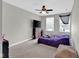 This bedroom has carpet, a ceiling fan, and a window with blinds at 10319 Pronghorn Ln, Indianapolis, IN 46239