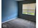 Cozy bedroom with plush carpet, ample natural light, and fresh paint at 10319 Pronghorn Ln, Indianapolis, IN 46239