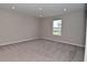 Large bedroom with neutral paint, recessed lighting, a window with blinds, and plush carpeting at 10319 Pronghorn Ln, Indianapolis, IN 46239