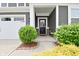 Welcoming front entrance with charming landscaping, stylish accents, and a covered entryway at 10319 Pronghorn Ln, Indianapolis, IN 46239