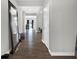 Inviting hallway with modern wood floors, leading to various rooms in the house at 10319 Pronghorn Ln, Indianapolis, IN 46239