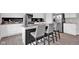 Modern kitchen featuring stainless steel appliances, white cabinets, and a center island with seating at 10319 Pronghorn Ln, Indianapolis, IN 46239