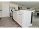 Well-appointed kitchen island featuring modern cabinetry and a stainless steel refrigerator at 10319 Pronghorn Ln, Indianapolis, IN 46239
