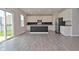 Modern kitchen featuring white cabinets, a stainless steel refrigerator, and a central island at 10319 Pronghorn Ln, Indianapolis, IN 46239