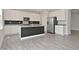 Stylish kitchen with white cabinetry, stainless steel appliances, and a functional island at 10319 Pronghorn Ln, Indianapolis, IN 46239