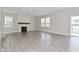 Bright living room featuring a fireplace and sliding glass door for easy outdoor access at 10319 Pronghorn Ln, Indianapolis, IN 46239