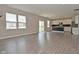 Spacious living room with sleek floors and a view of the modern kitchen area at 10319 Pronghorn Ln, Indianapolis, IN 46239