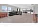 Spacious living room with hardwood floors, natural light and white kitchen in background at 10319 Pronghorn Ln, Indianapolis, IN 46239
