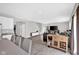 Open-concept living room with hardwood floors, natural light, and modern furnishings at 10319 Pronghorn Ln, Indianapolis, IN 46239