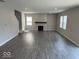 Spacious living room featuring hard surface floors, recessed lighting, and a cozy fireplace at 10319 Pronghorn Ln, Indianapolis, IN 46239