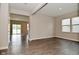 Bright living room with neutral walls, hard wood flooring, an open floor plan, and lots of light at 10319 Pronghorn Ln, Indianapolis, IN 46239