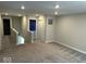 Upstairs loft area boasts plush carpeting and recessed lighting at 10319 Pronghorn Ln, Indianapolis, IN 46239