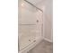 Modern shower features glass doors, tiled walls, and updated fixtures at 10319 Pronghorn Ln, Indianapolis, IN 46239
