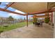 Spacious backyard features a patio, swing set, dining area, and green grass at 10955 Balfour Dr, Noblesville, IN 46060