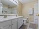 Bright bathroom with double vanity, toilet, and tiled shower with glass door at 10955 Balfour Dr, Noblesville, IN 46060