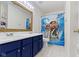 This bathroom features a double sink vanity, white tile floors and a Moana themed shower curtain at 10955 Balfour Dr, Noblesville, IN 46060