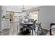 Stylish dining area featuring a modern table, comfortable seating, and beautiful natural light at 10955 Balfour Dr, Noblesville, IN 46060
