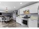 Open kitchen featuring stainless steel appliances, granite countertops, and seamless access to living area at 10955 Balfour Dr, Noblesville, IN 46060