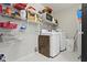 Functional laundry room with shelving providing ample storage space and convenience at 10955 Balfour Dr, Noblesville, IN 46060
