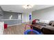 Spacious living area featuring hardwood floors, comfortable seating, and modern design at 10955 Balfour Dr, Noblesville, IN 46060