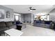 Expansive living room with plentiful seating and views into kitchen and entry at 10955 Balfour Dr, Noblesville, IN 46060