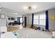 Open-concept living space with lots of light, seamlessly connecting to the office and Gathering room at 10955 Balfour Dr, Noblesville, IN 46060
