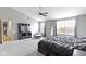 This spacious primary bedroom boasts carpet floors, ample space, and large windows for natural light at 10955 Balfour Dr, Noblesville, IN 46060