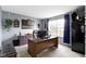 Comfortable home office with a large desk, ample storage, and natural light at 10955 Balfour Dr, Noblesville, IN 46060
