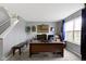Spacious home office with a large desk, comfortable seating, and bright natural light at 10955 Balfour Dr, Noblesville, IN 46060
