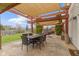 Covered patio with outdoor dining table and seating area at 10955 Balfour Dr, Noblesville, IN 46060