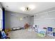 Fun and functional playroom with soft carpeting and plenty of space for activities at 10955 Balfour Dr, Noblesville, IN 46060