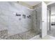 Large shower boasts tiled walls, mosaic floor, and built-in shower caddy at 10955 Balfour Dr, Noblesville, IN 46060