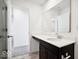 Bathroom featuring a white quartz countertop, dark brown cabinets, and a large mirror at 1117 Stubble Run, Danville, IN 46122