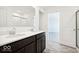 Modern bathroom with double sinks, walk-in shower, and a view of a nearby room at 1117 Stubble Run, Danville, IN 46122