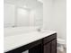 Bathroom featuring a white quartz countertop, dark brown cabinets, and a large mirror at 1117 Stubble Run, Danville, IN 46122