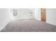 A light-filled bedroom features carpet flooring and an attached bathroom at 1117 Stubble Run, Danville, IN 46122
