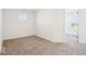Bedroom with neutral carpeting, a window, and bright white walls at 1117 Stubble Run, Danville, IN 46122