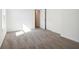 A bright bedroom features neutral carpet, a window, and white walls at 1117 Stubble Run, Danville, IN 46122