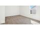Bright bedroom features a window with trim and neutral carpeting at 1117 Stubble Run, Danville, IN 46122