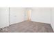 A bright bedroom features neutral carpet, a window, and white walls at 1117 Stubble Run, Danville, IN 46122