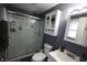 Well-lit bathroom with walk-in shower, cabinet, and modern fixtures at 1255 Easy St, Greenwood, IN 46142